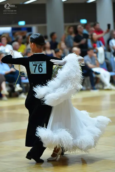 Dancesport competitor #76: Male dancer: black suit