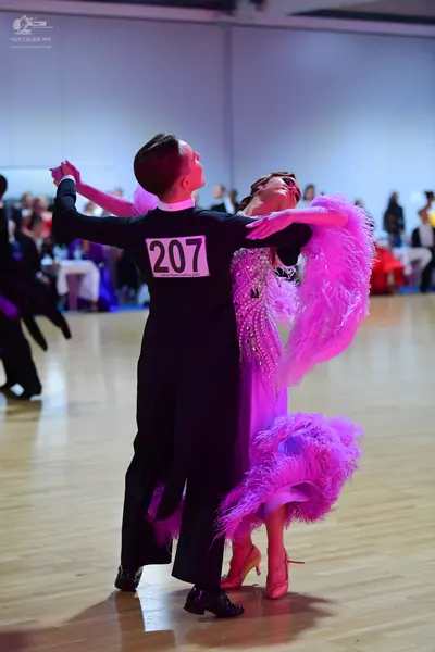 Dancesport competitor #207: Male dancer: black long-sleeved top and black trousers