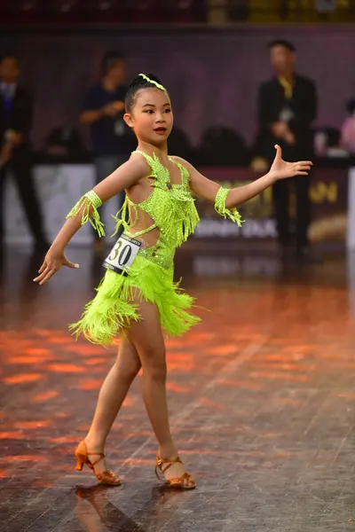 Dancesport competitor #30: Female dancer: lime green latin dress with fringe