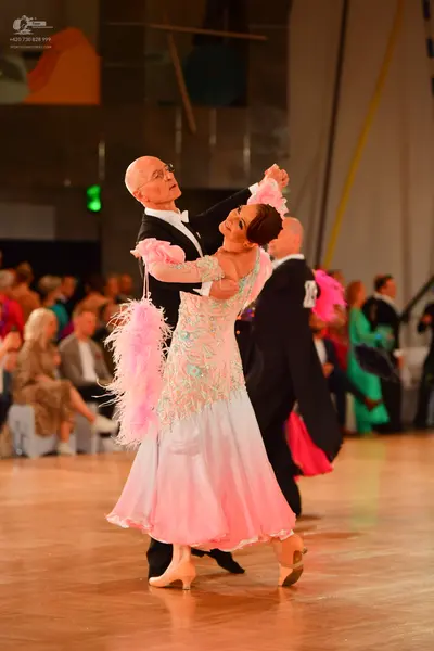 Dancesport competitor #23: Male dancer: black tuxedo with a white shirt and white bow tie