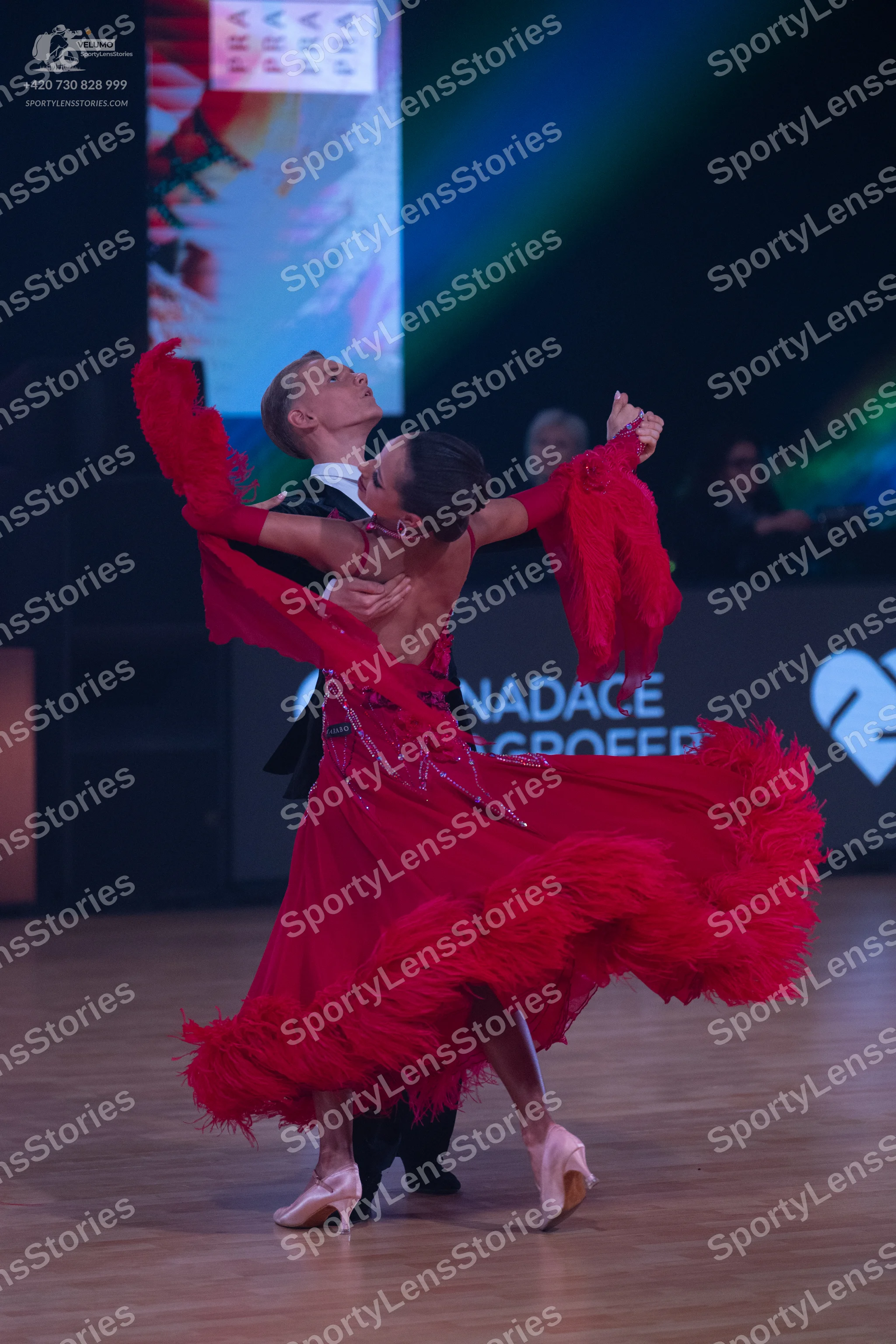 Dancesport competitor: Male dancer: black suit with a white shirt