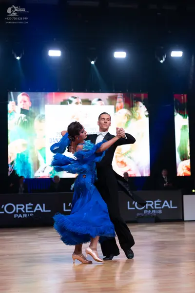 Dancesport competitor: Male dancer: black tailcoat suit with a white shirt and black bow tie