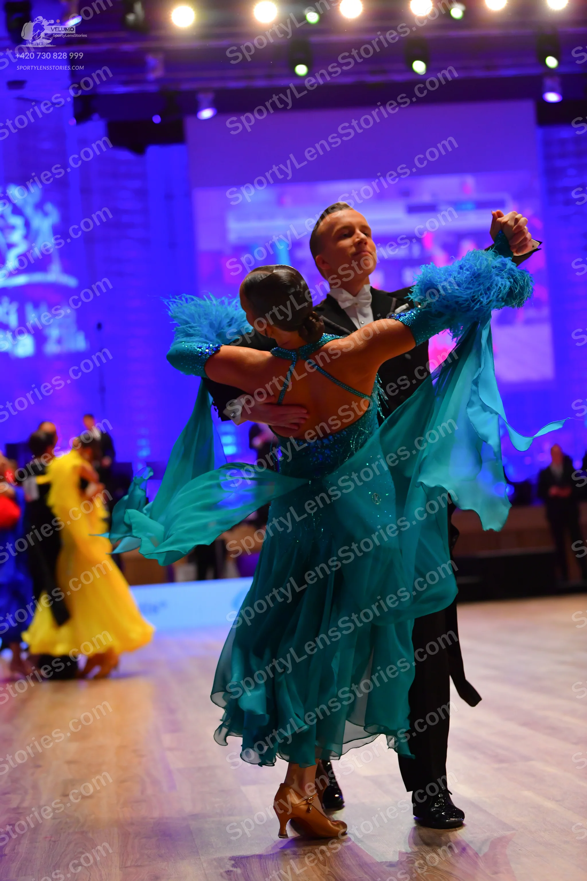 Dancesport competitor: Male dancer: black formal ballroom suit
