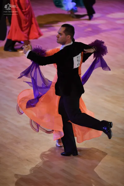Dancesport competitor: ** Black suit with black footwear