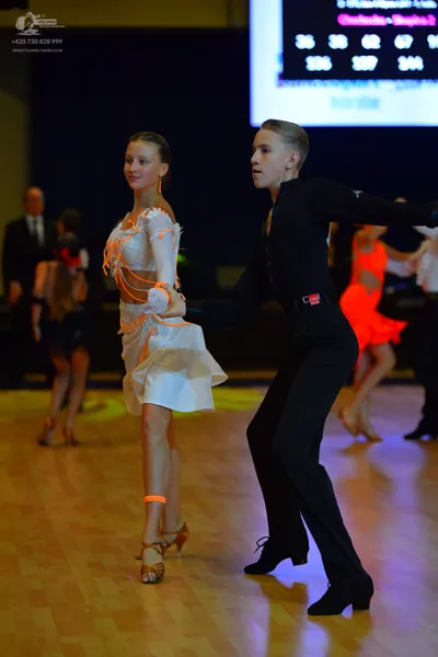 Dancesport competitor: Male dancer: black long-sleeve shirt and black trousers