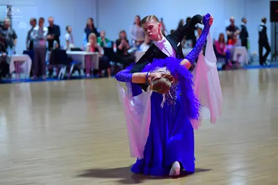 Dancesport competitor: Male dancer: black ballroom suit with a white shirt