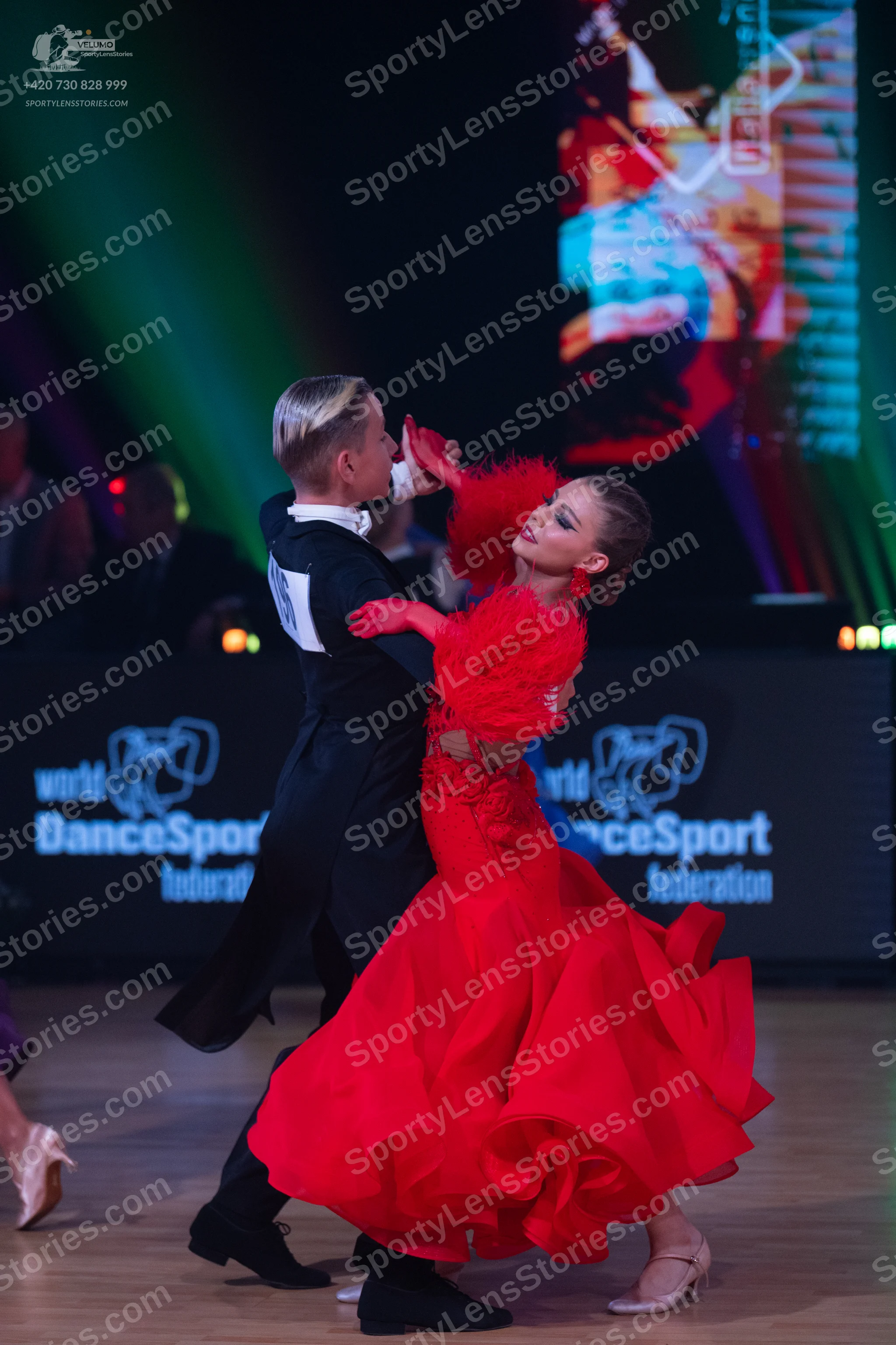 Dancesport competitor: Male dancer: black ballroom suit with black trousers and black dance shoes