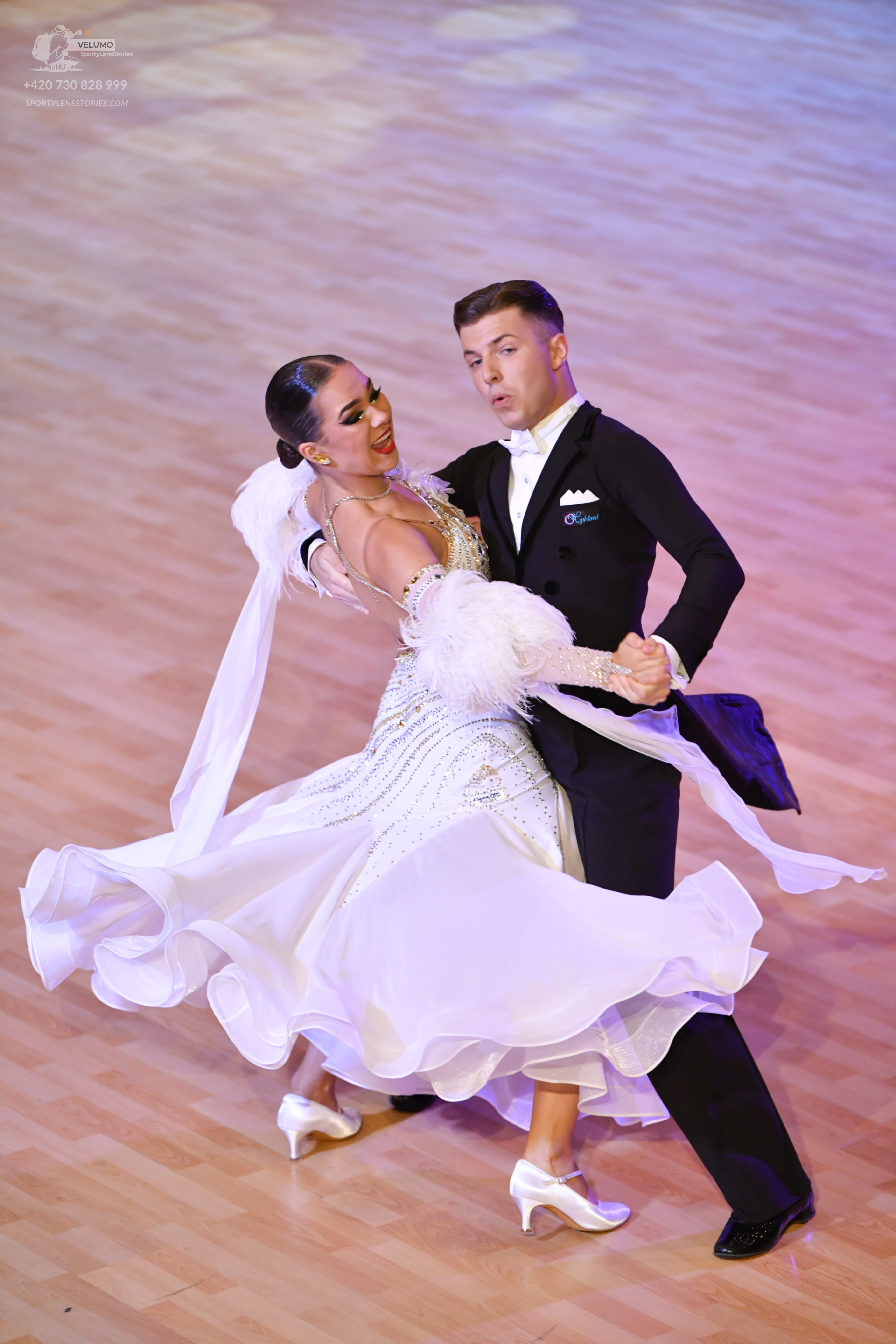 Dancesport competitor: ** Male: Black tail suit with silver sequin lapels and a high collar