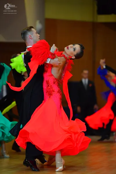 Dancesport competitor: Male dancer: black suit