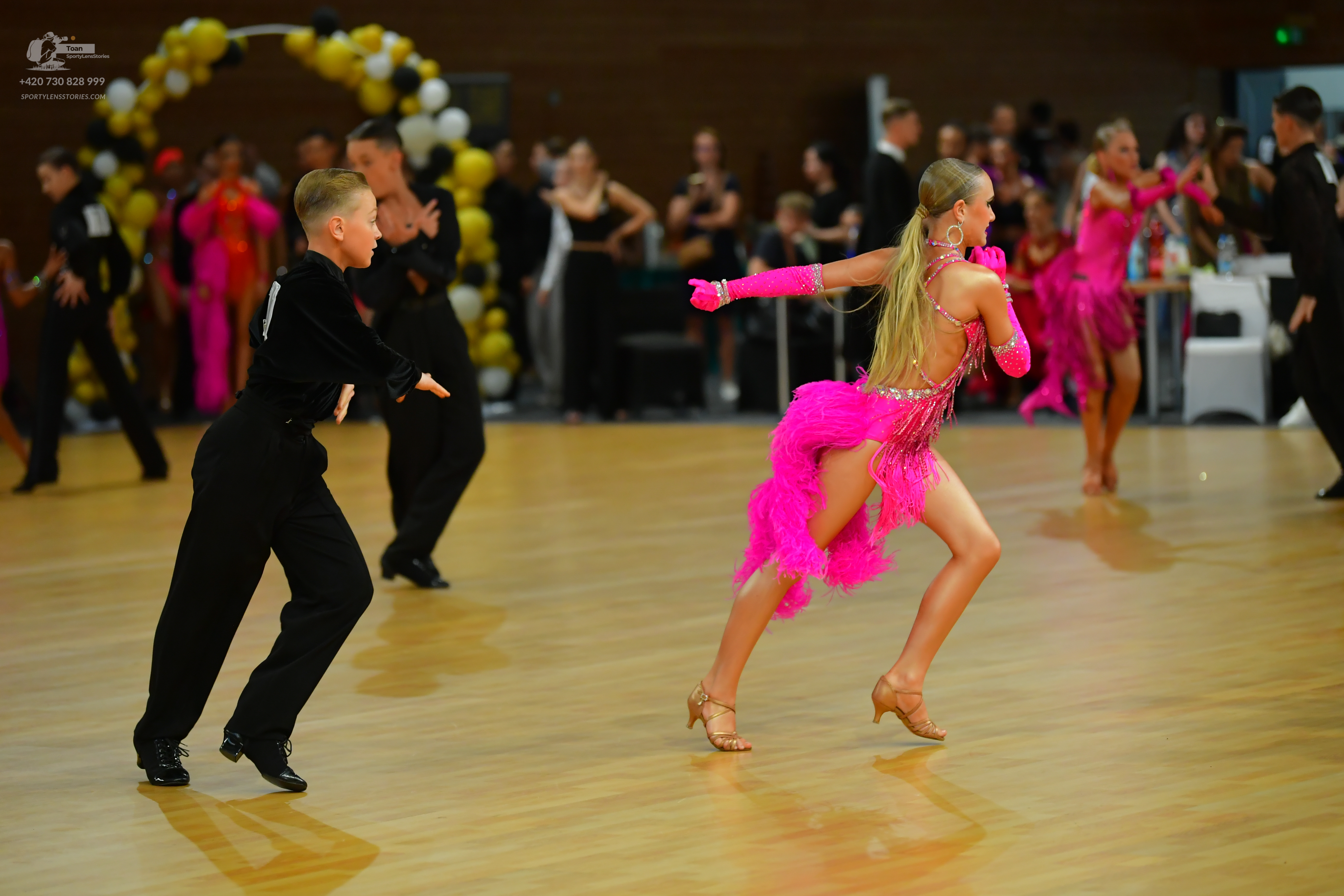 Dancesport competitor: ** Black tail suit with silver sequin lapels and cuffs