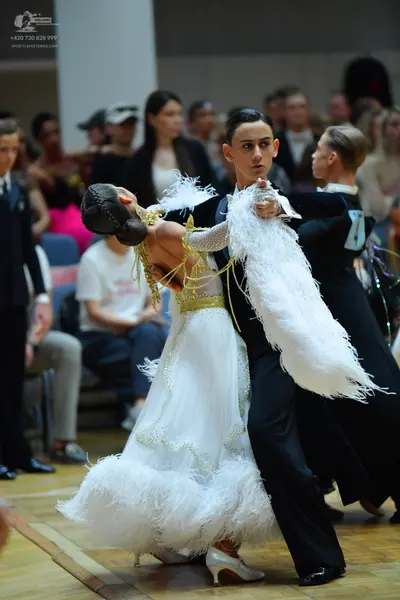 Dancesport competitor: Male dancer: black ballroom suit