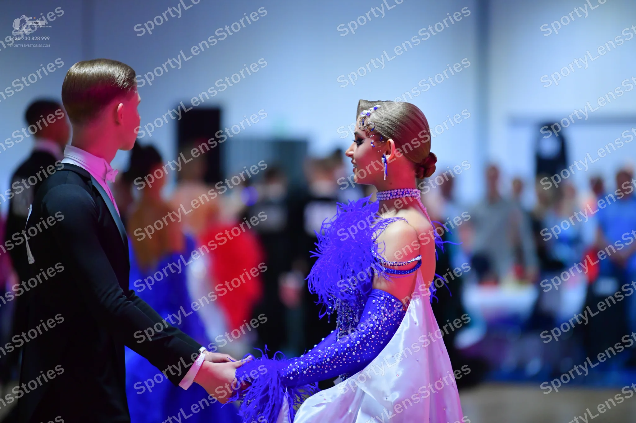 Dancesport competitor: Male dancer: black suit with a white shirt and white bow tie