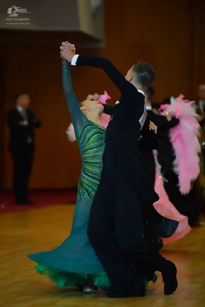 Dancesport competitor: ** Black tail suit