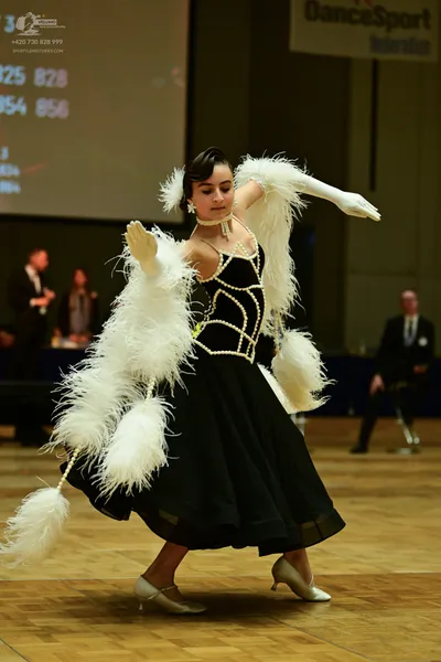 Dancesport competitor: ** Black Ballgown
*   **Fabric:** Likely satin or a similar smooth fabric, possi