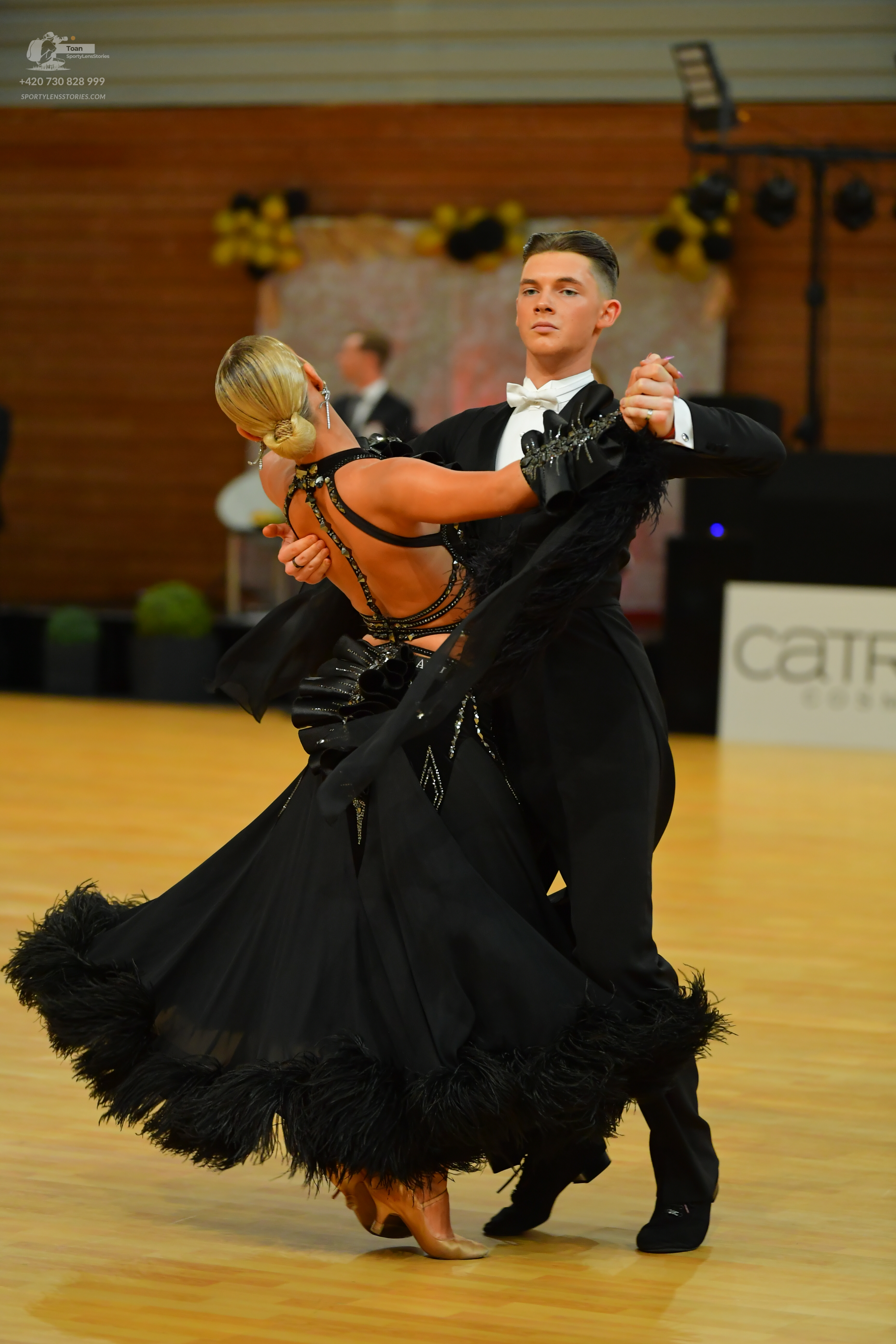 Dancesport competitor: ** Male: Black tail suit with a sequin-covered lapel and fringe on the sleeves