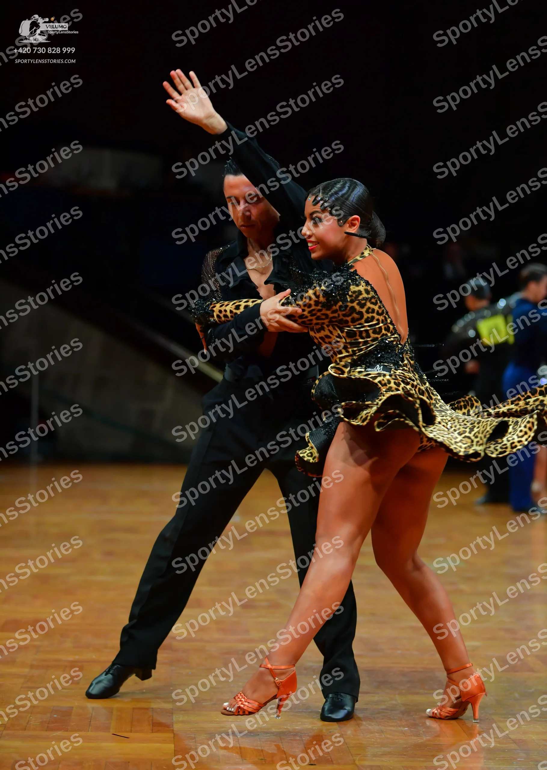 Dancesport competitor: Male dancer: black long-sleeved shirt and black trousers