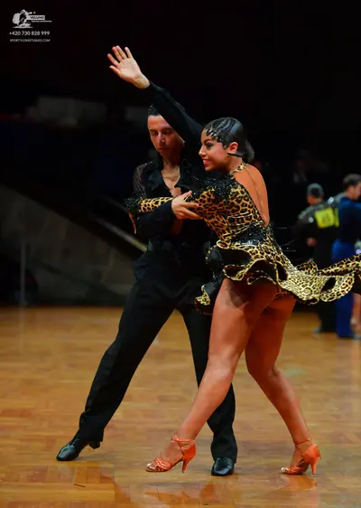Dancesport competitor: Male dancer: black long-sleeved shirt and black trousers