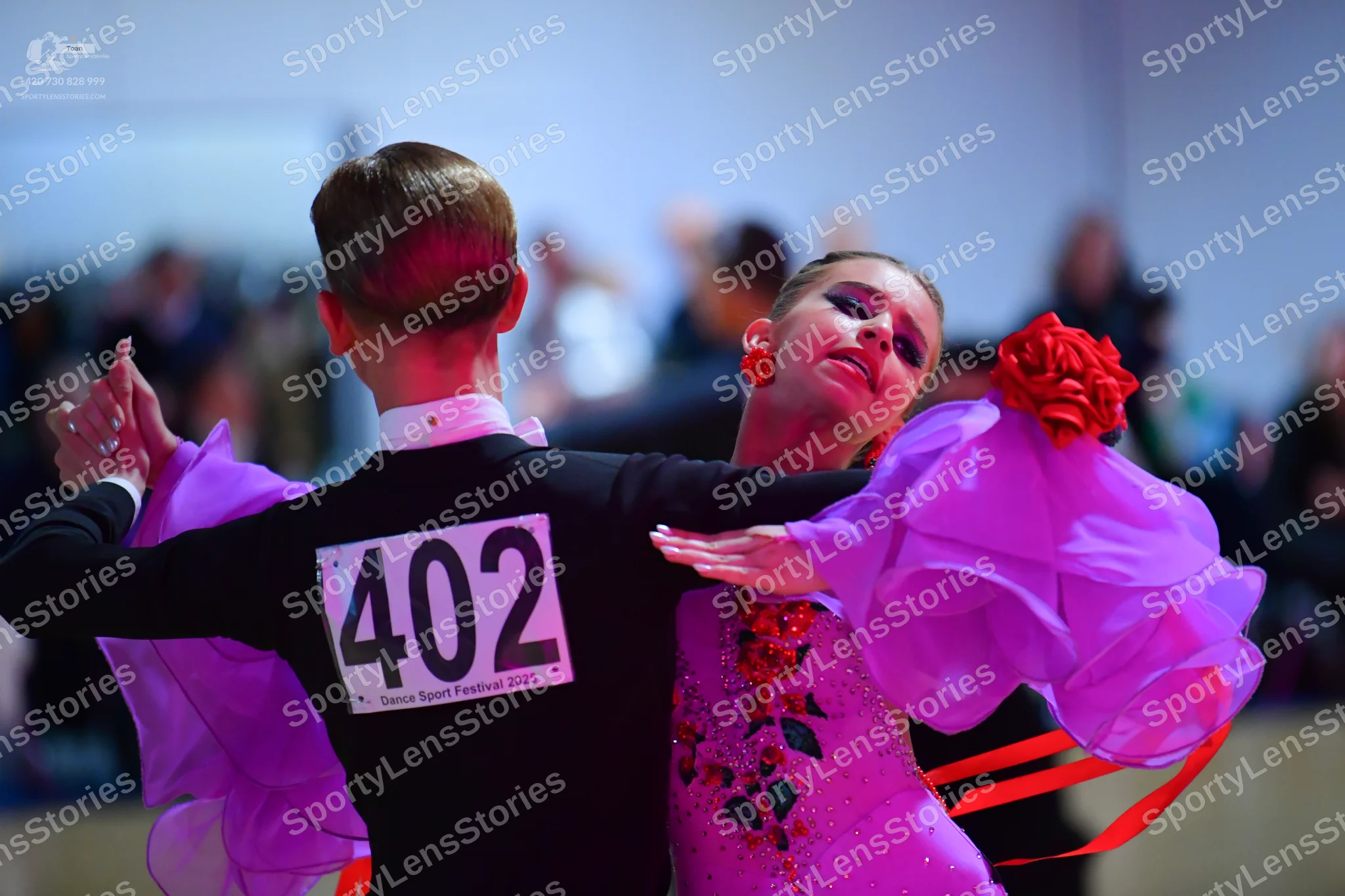Dancesport competitor #402: Male dancer: black long-sleeved shirt with a white collar
