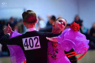 Dancesport competitor #402: Male dancer: black long-sleeved shirt with a white collar