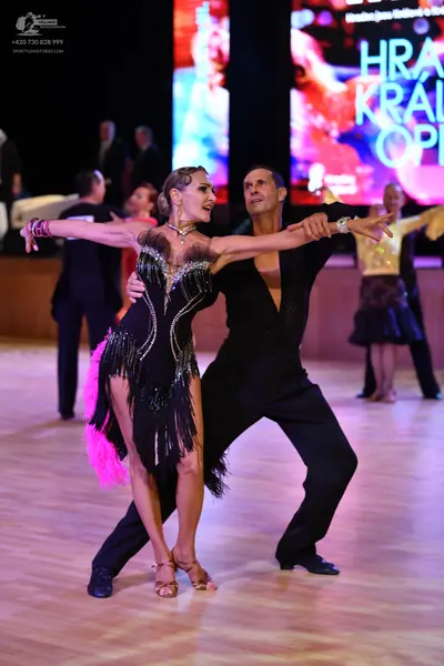 Dancesport competitor: ** Black suit with a subtle sequin pattern on the lapels