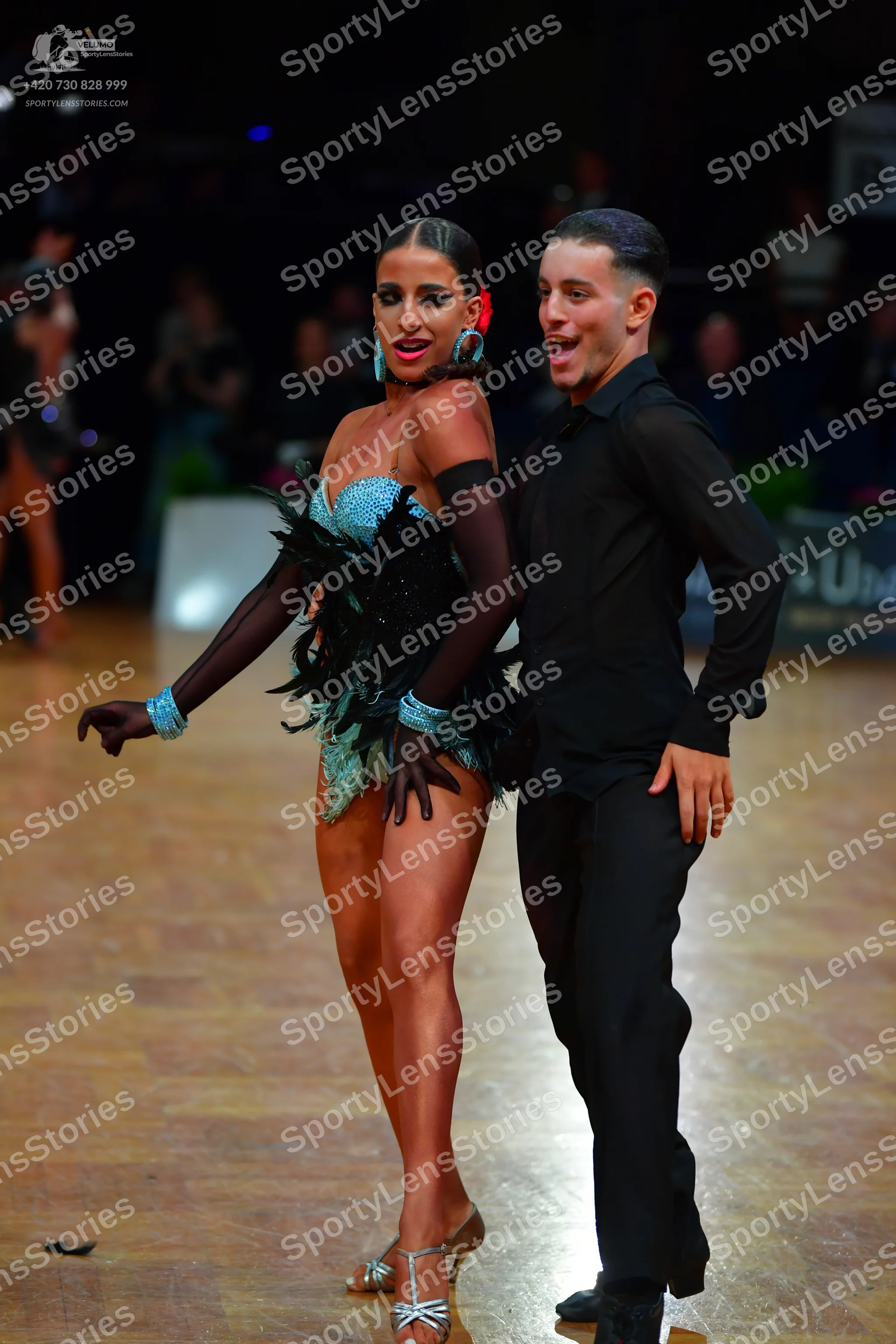Dancesport competitor: Male dancer: black long-sleeved shirt and black trousers