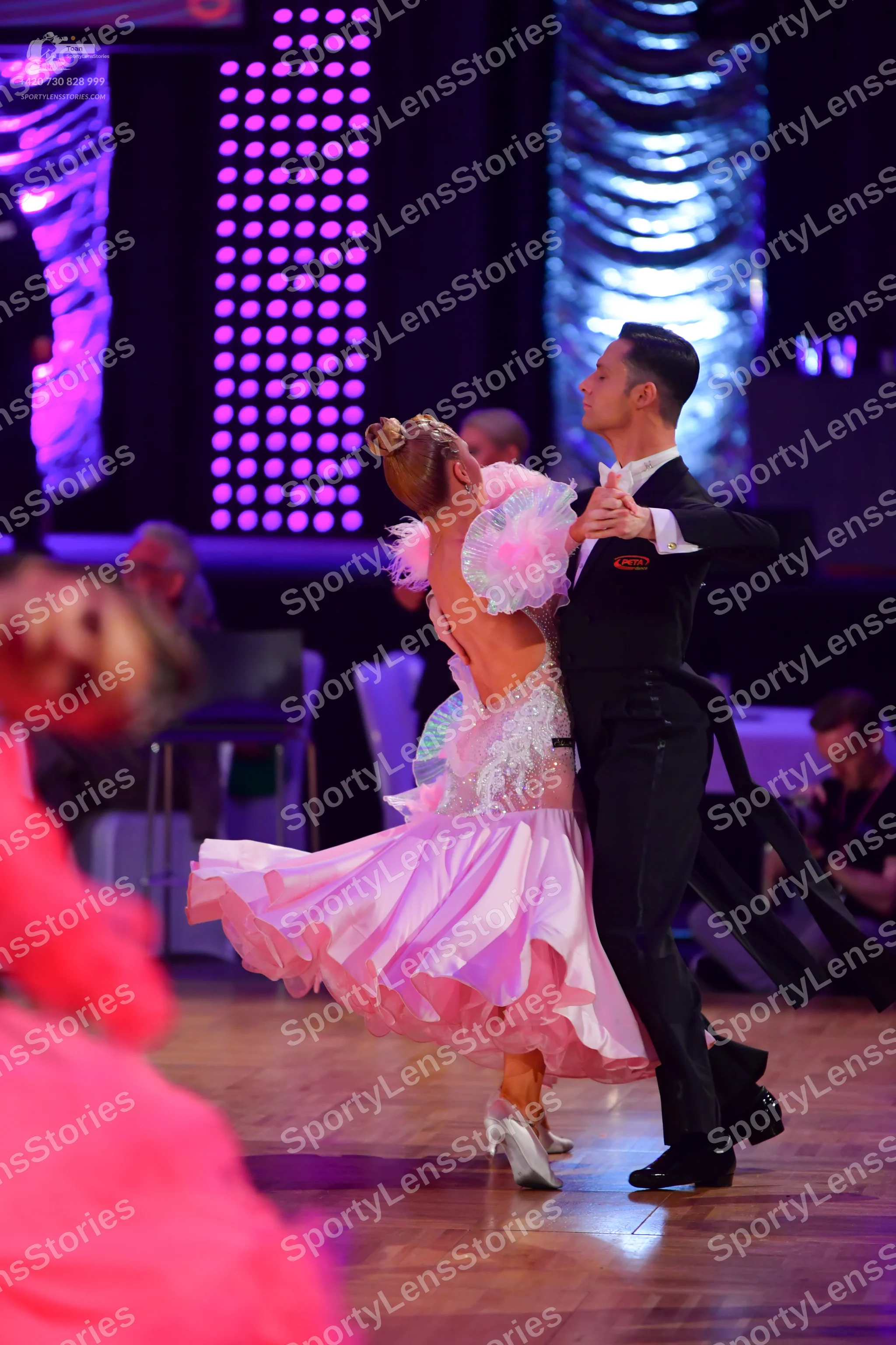 Dancesport competitor: Male dancer: black suit
