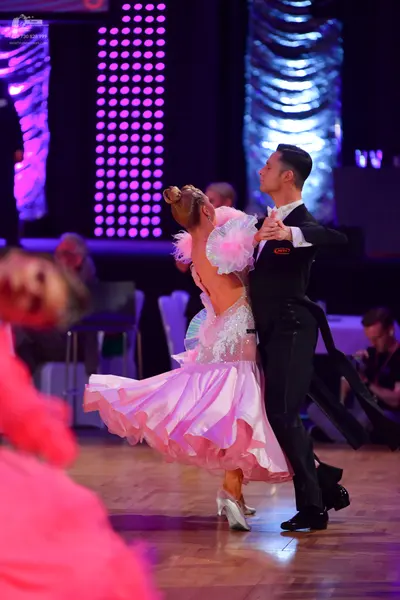 Dancesport competitor: Male dancer: black suit