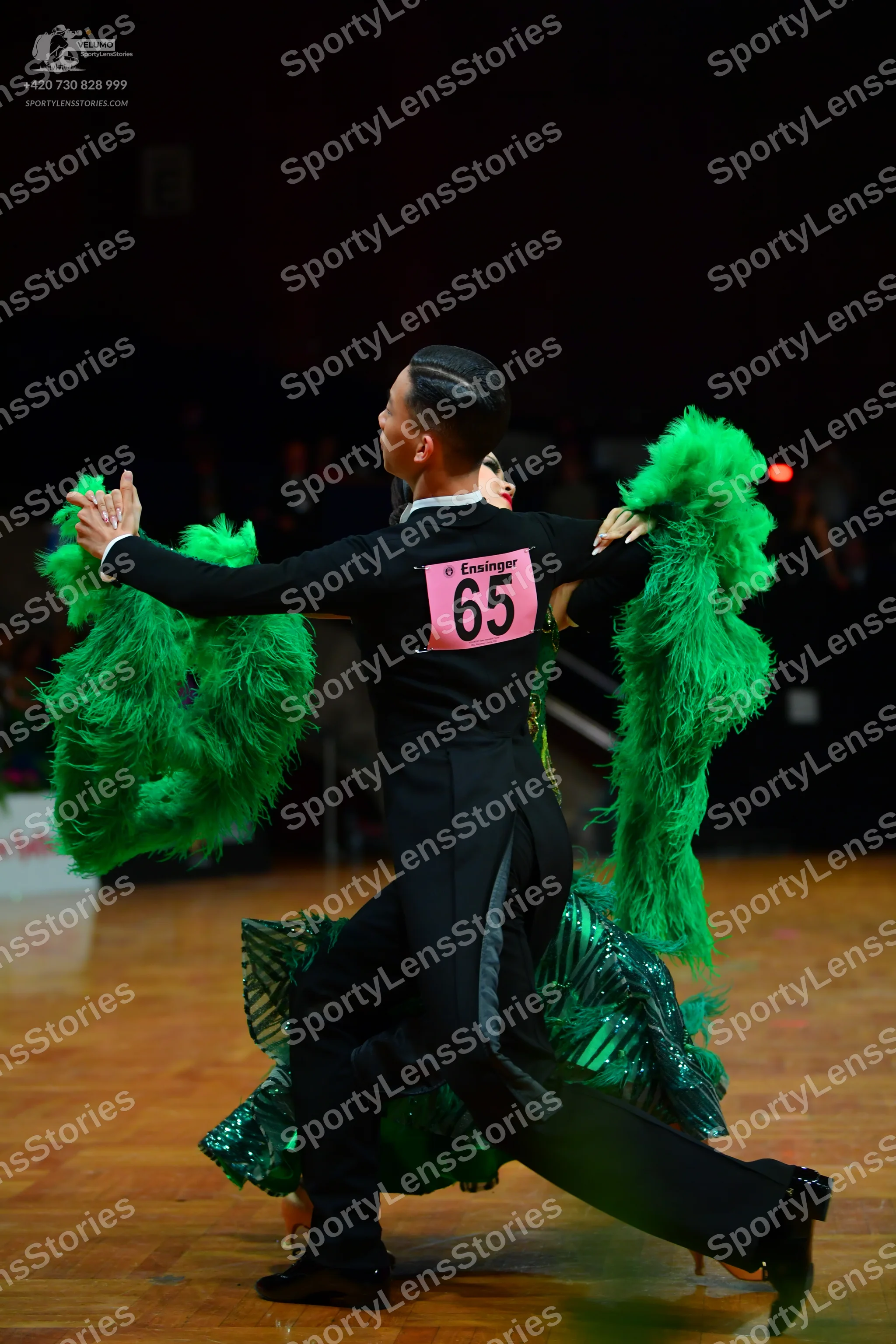 Dancesport competitor: Male dancer: black long-sleeved shirt and black trousers