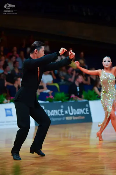 Dancesport competitor: Male dancer: black suit