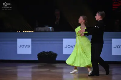 Dancesport competitor: Male dancer: black suit and trousers with black dance shoes