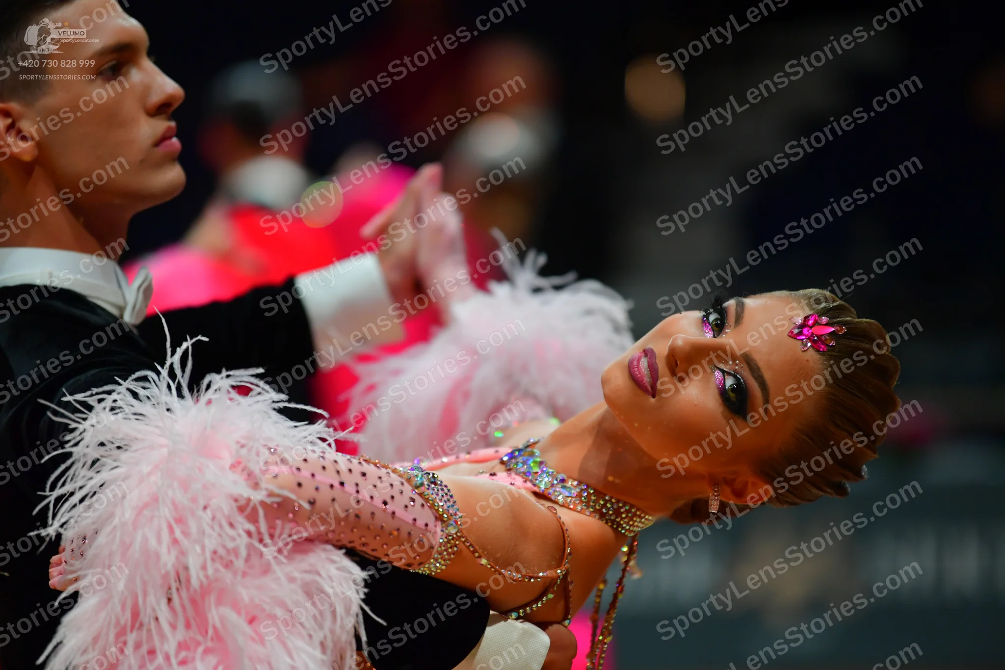 Dancesport competitor: Male dancer: black suit with a white shirt