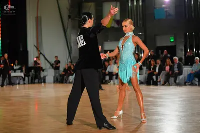 Dancesport competitor #15: Male dancer: black velvet long-sleeved shirt and black trousers