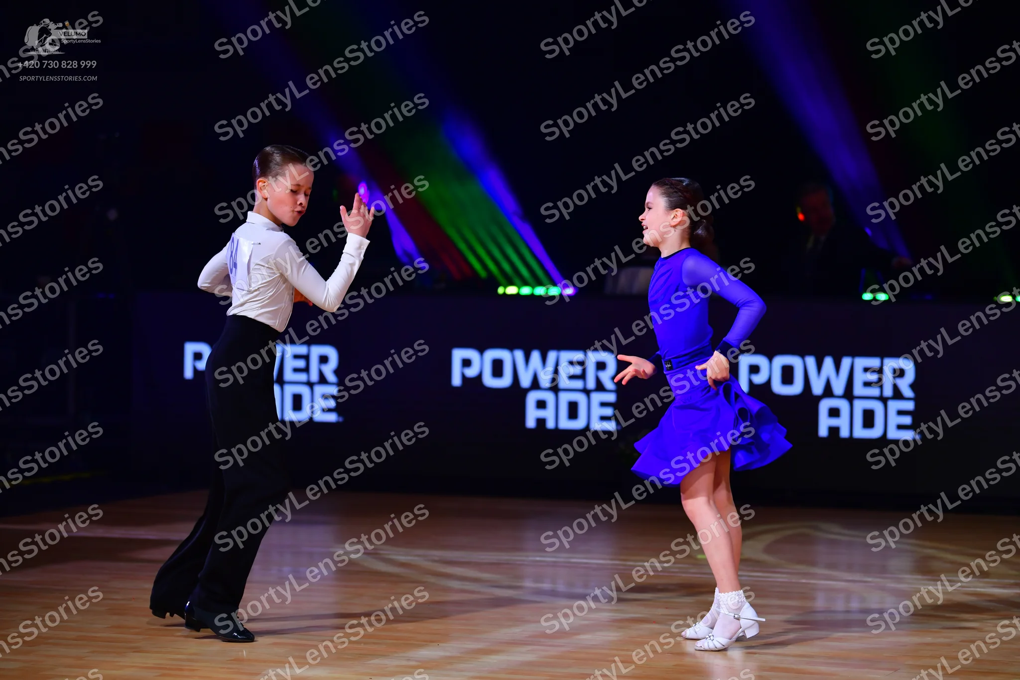 Dancesport competitor: Male dancer: white long-sleeved shirt and black trousers
