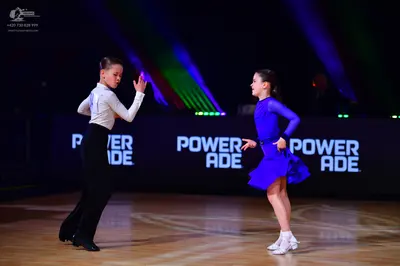 Dancesport competitor: Male dancer: white long-sleeved shirt and black trousers
