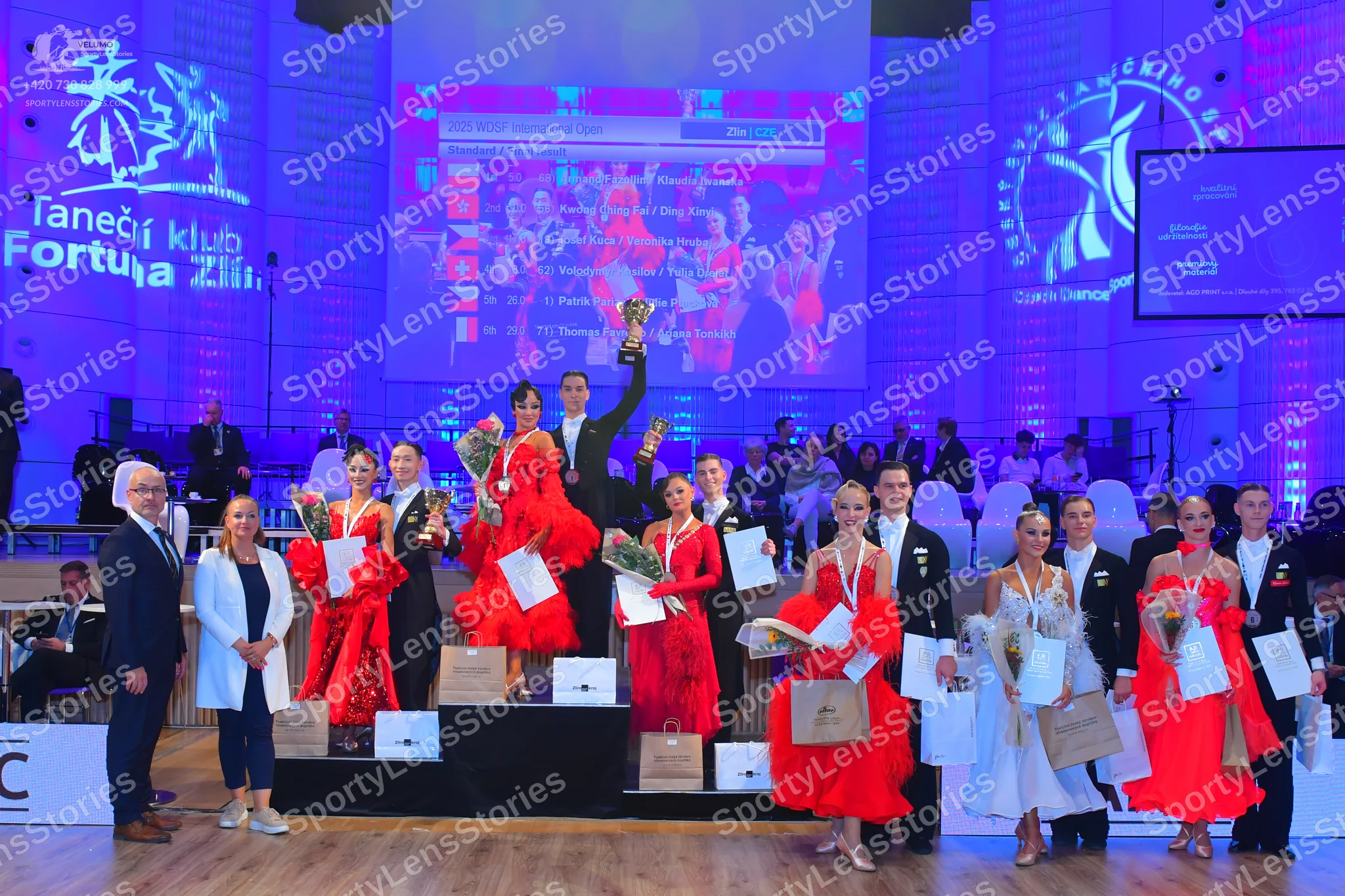 Dancesport competitor: Female dancers: various vibrant red ballroom or latin dresses made of satin or l