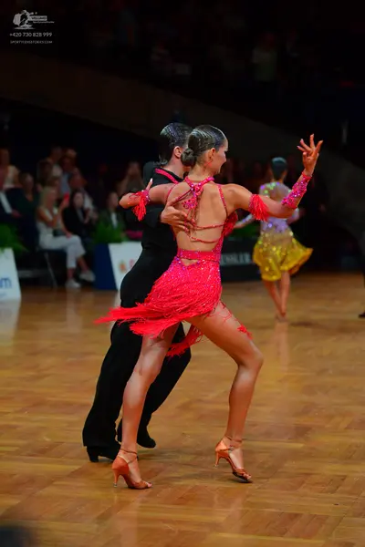 Dancesport competitor: Male dancer: black suit
