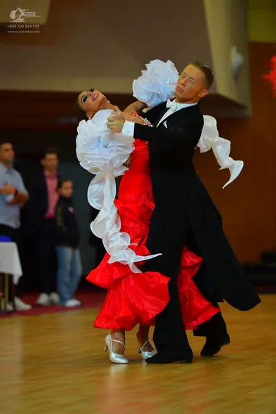 Dancesport competitor: Male dancer: black suit
