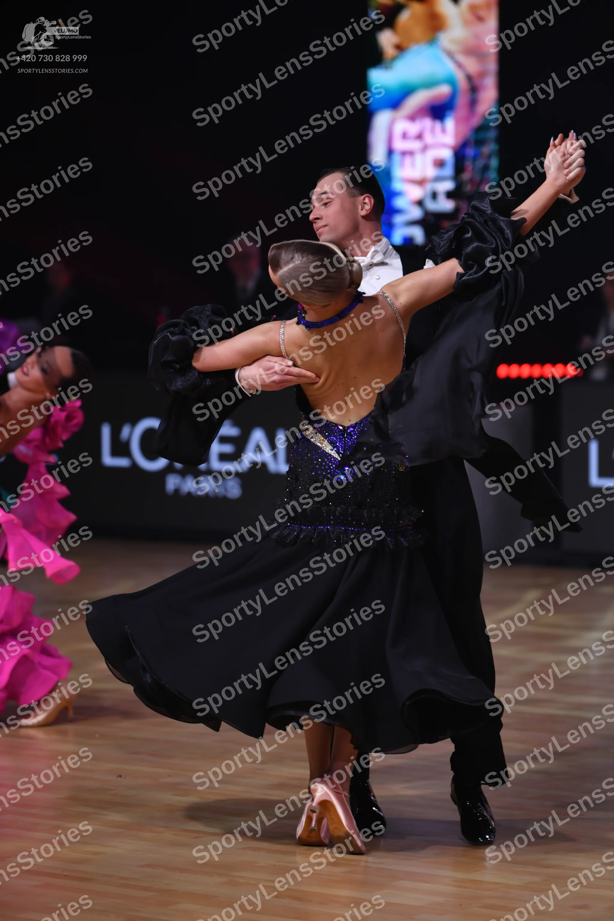 Dancesport competitor: Male dancer: black suit with a white shirt