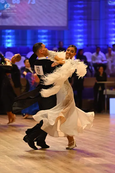 Dancesport competitor: Male dancer: black long-sleeved shirt and black trousers
