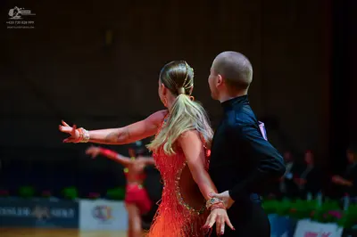Dancesport competitor: Male dancer: black long-sleeved shirt