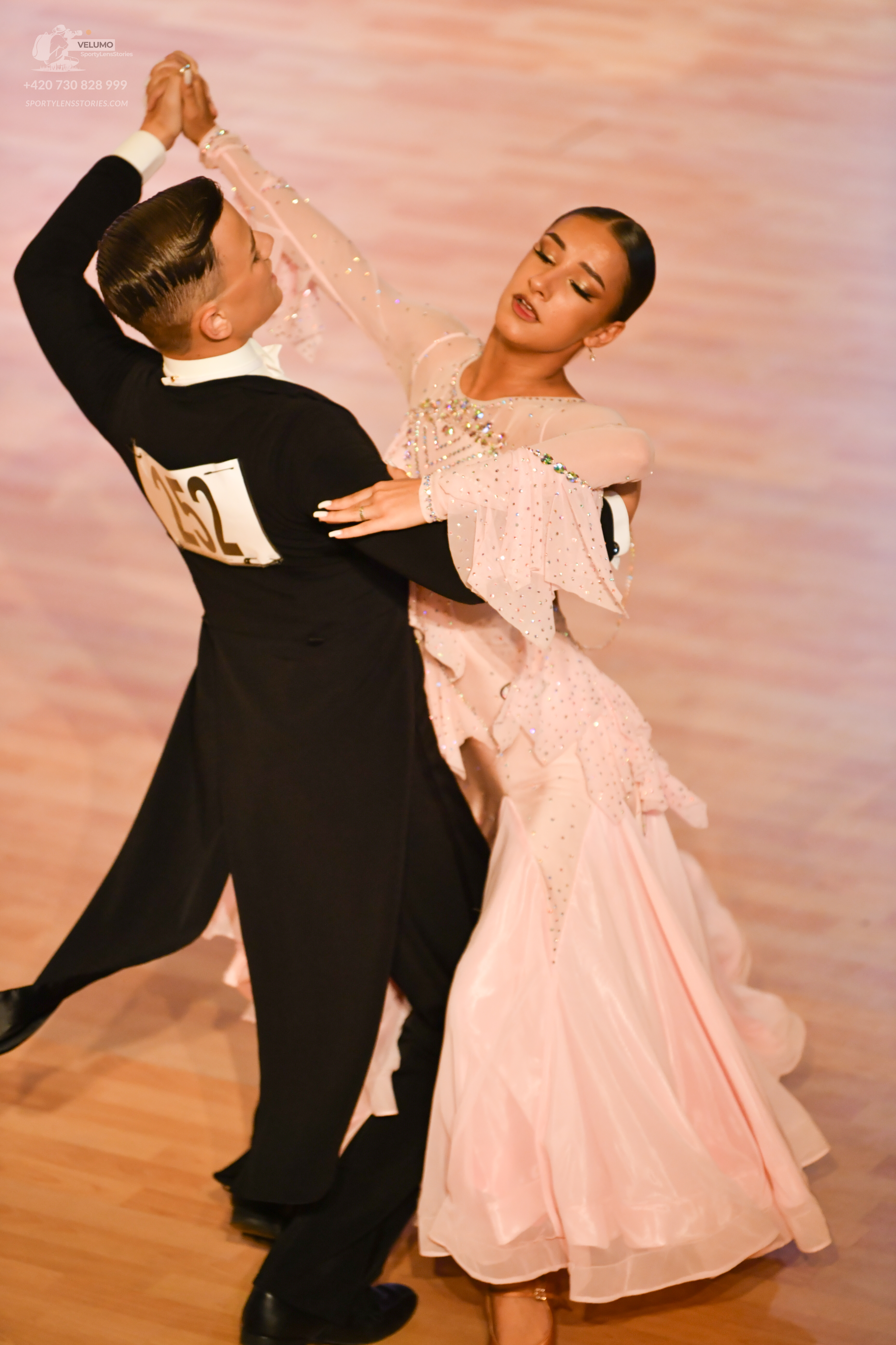 Dancesport competitor: Male**
*   **Color:** Black
*   **Fabric:** Sequin
*   **Style:** Tail suit with