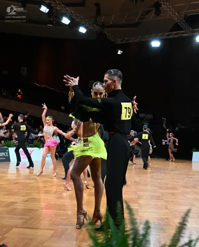 Dancesport competitor #155, #79: Male dancer (79): black long-sleeved shirt and black trousers