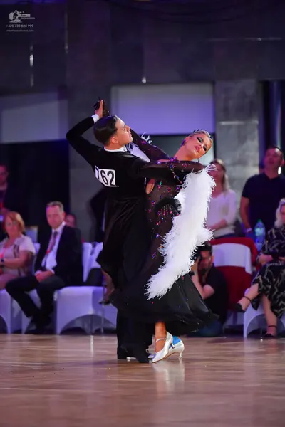 Dancesport competitor #762: Male dancer: black long-sleeved dance shirt and black trousers