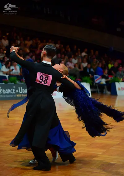 Dancesport competitor: Male dancer: black suit