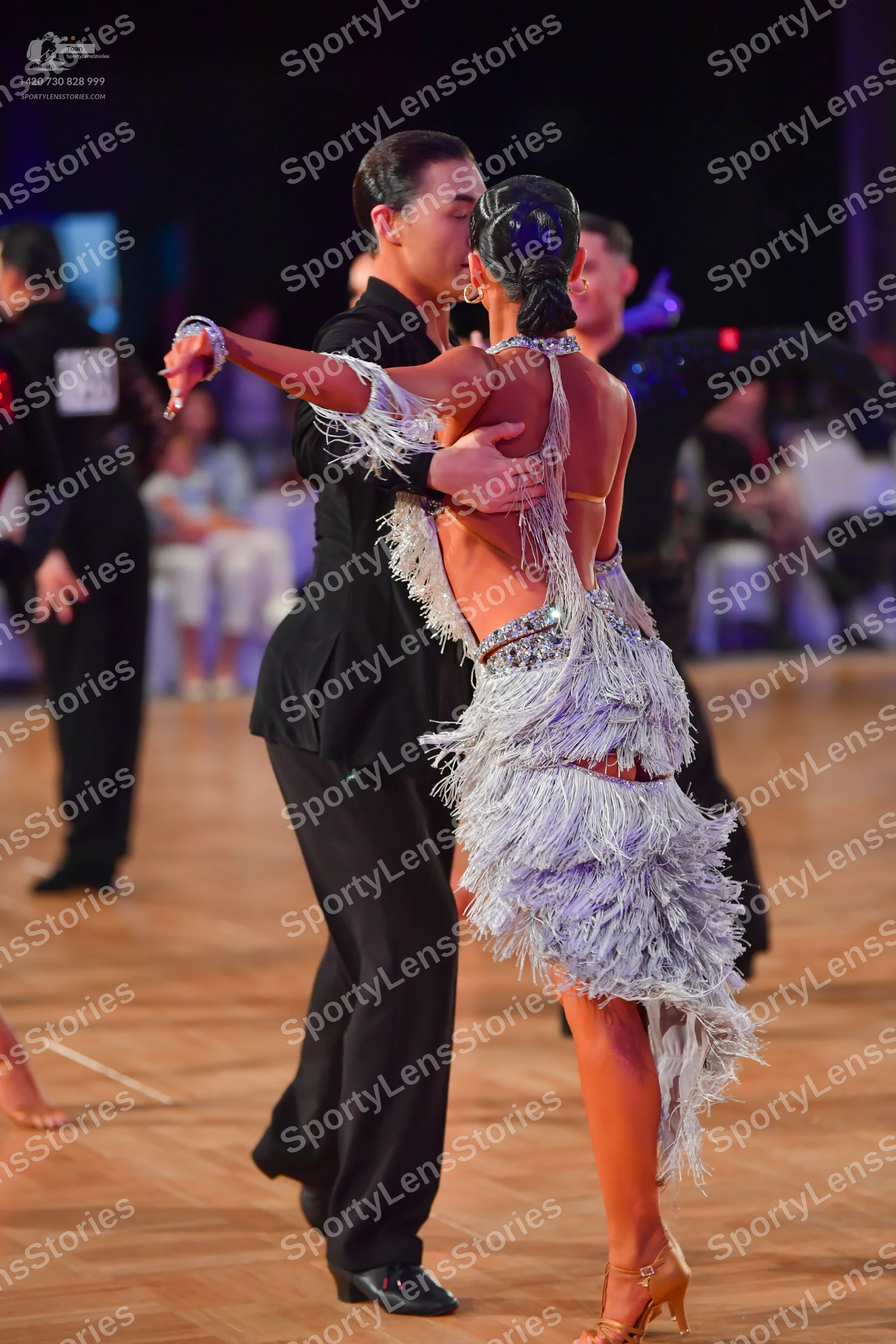 Dancesport competitor: Male dancer: black long-sleeved top and black trousers