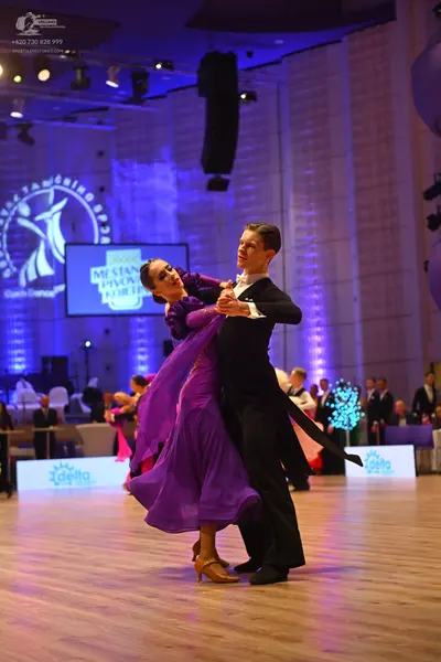 Dancesport competitor: Male dancer: black ballroom suit