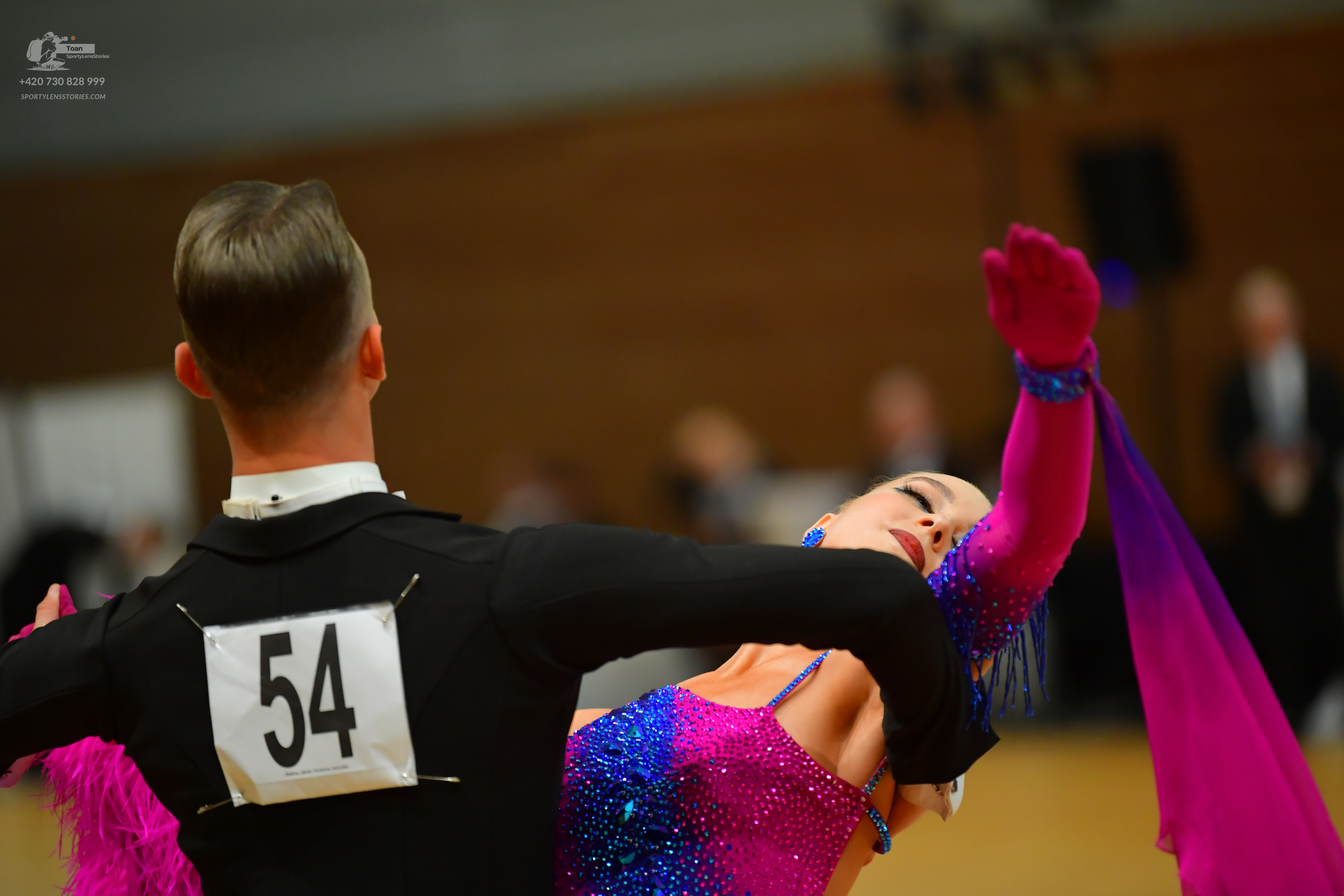 Dancesport competitor #54: Male:** Black tailsuit with sequin lapels