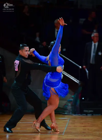 Dancesport competitor: Male dancer: black long-sleeved shirt with subtle shimmer and black trousers