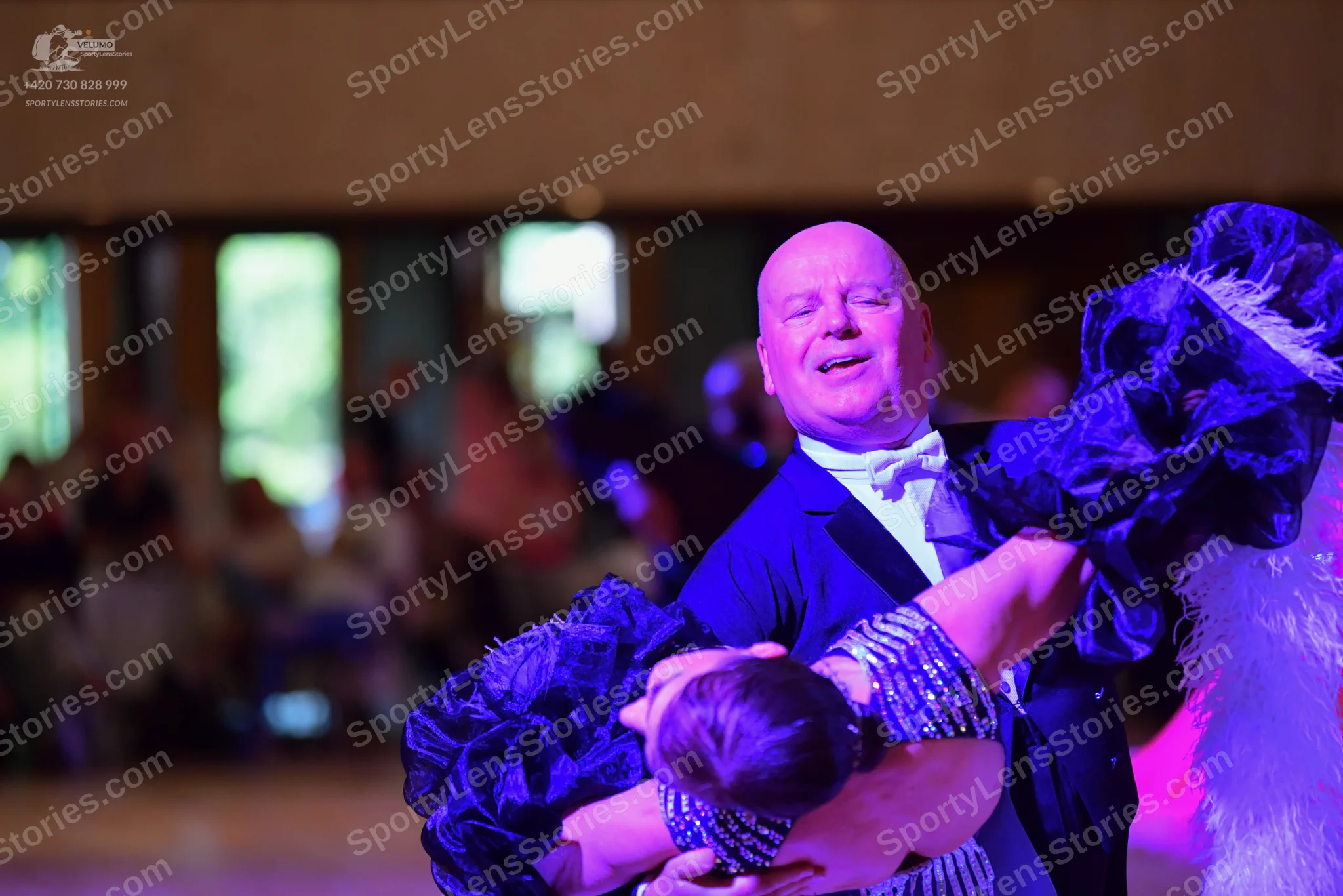 Dancesport competitor: Male:** Black tailsuit with sequin lapels and a white bow tie