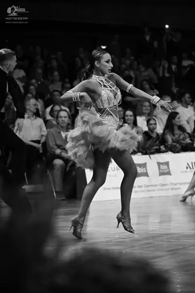 Dancesport competitor: Male dancer: black suit